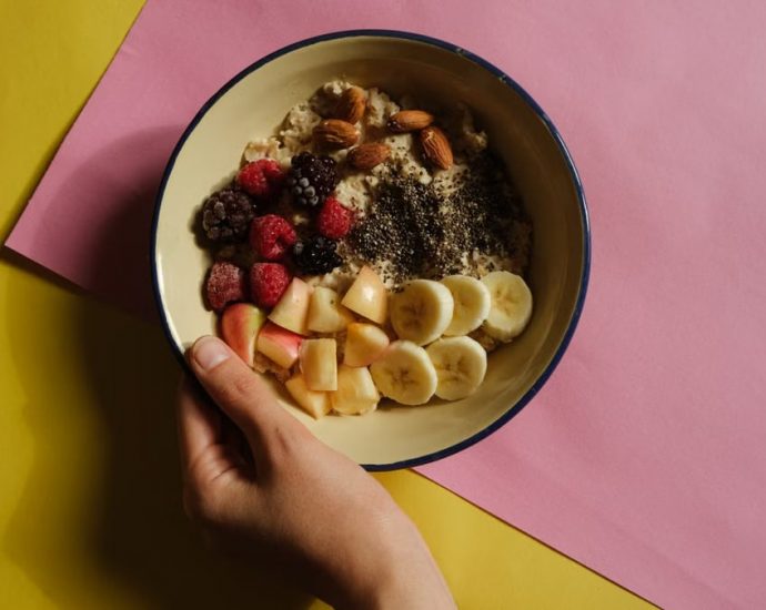 Delicious oatmeal bowl with fresh fruits and nuts, perfect for a healthy breakfast.