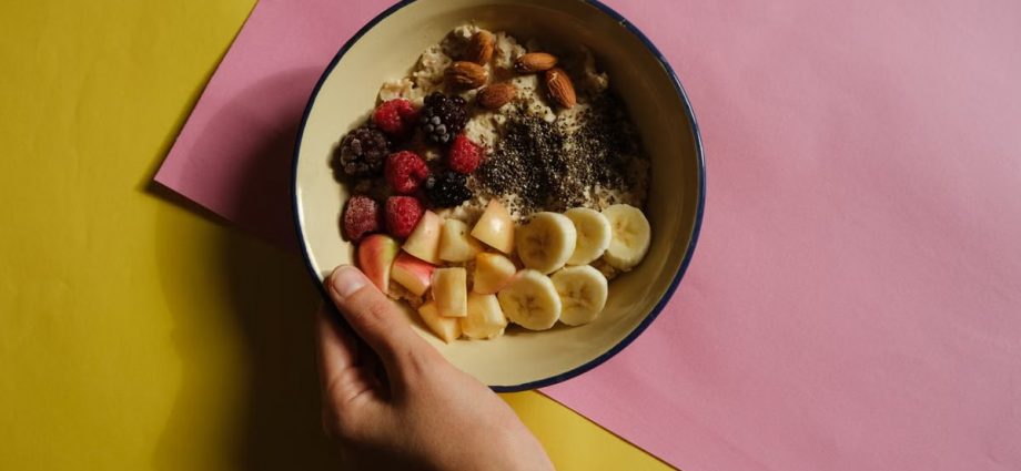 Delicious oatmeal bowl with fresh fruits and nuts, perfect for a healthy breakfast.